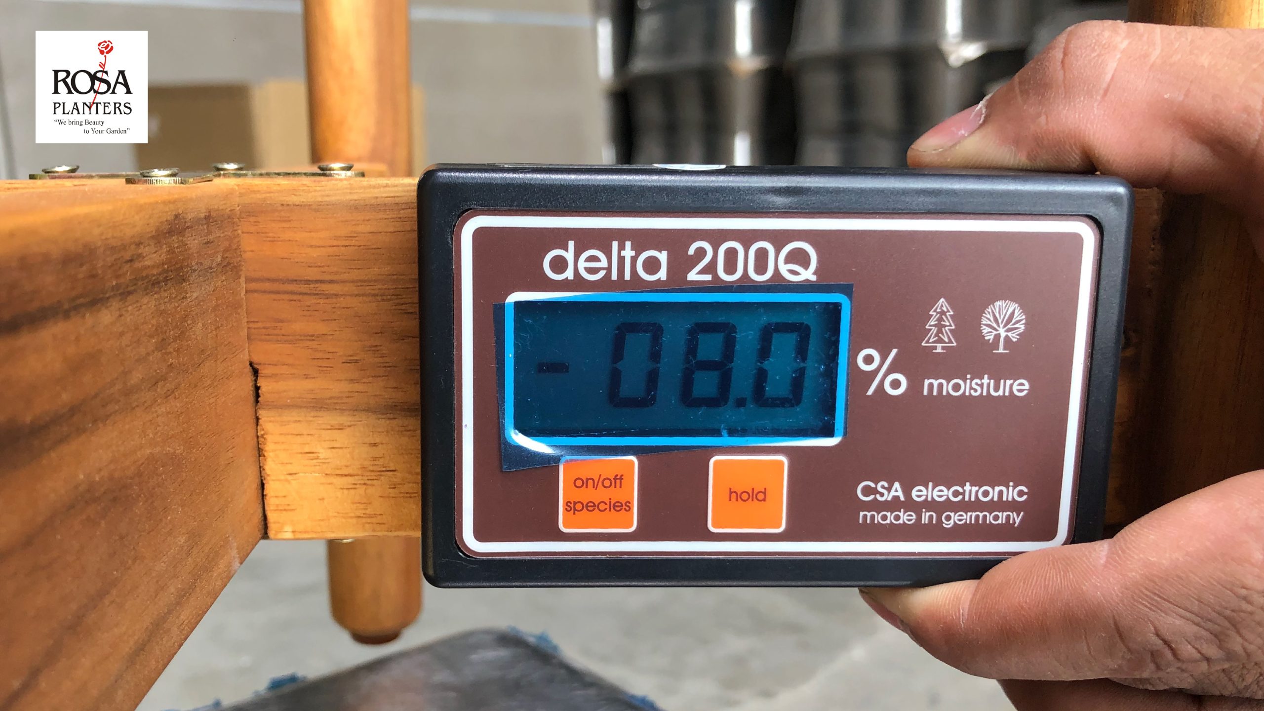 QC-staff-using-a-wood-moisture-meter-at-Rosa-Planters